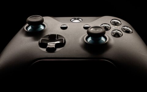 A detailed close-up of a modern gaming controller highlighting its design and functionality.