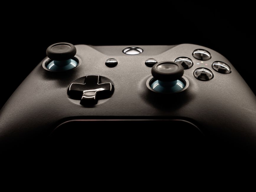 A detailed close-up of a modern gaming controller highlighting its design and functionality.